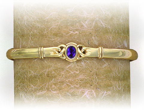 SOLID BANGLE WITH CIRCULAR CELTIC STONE SET FEATURE