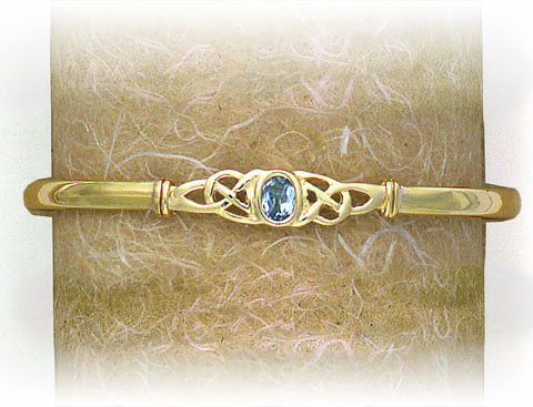 SOLID BANGLE CELTIC PATTERN WITH STONE SET FEATURE