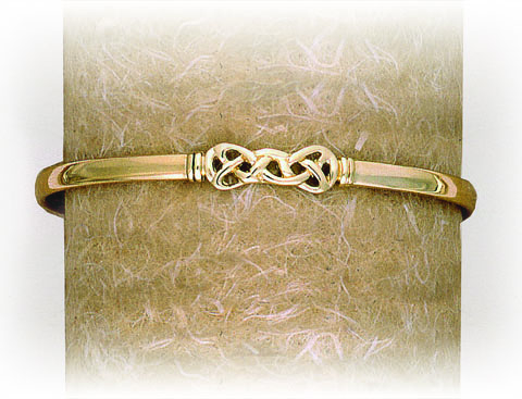 SOLID BANGLE WITH BOW STYLE CELTIC FEATURE